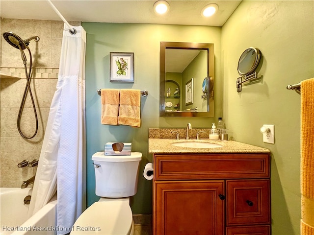 full bathroom featuring vanity, toilet, and shower / tub combo