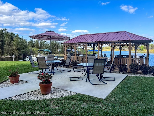 view of patio / terrace featuring a gazebo and a water view