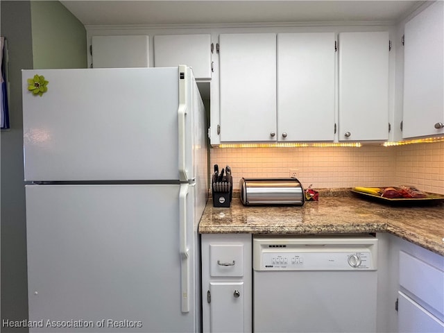 kitchen featuring white cabinets, white appliances, and backsplash