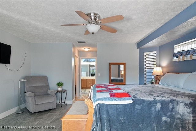 tiled bedroom with ceiling fan and ensuite bathroom