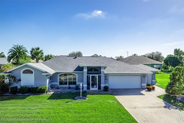 ranch-style home with a front yard and a garage