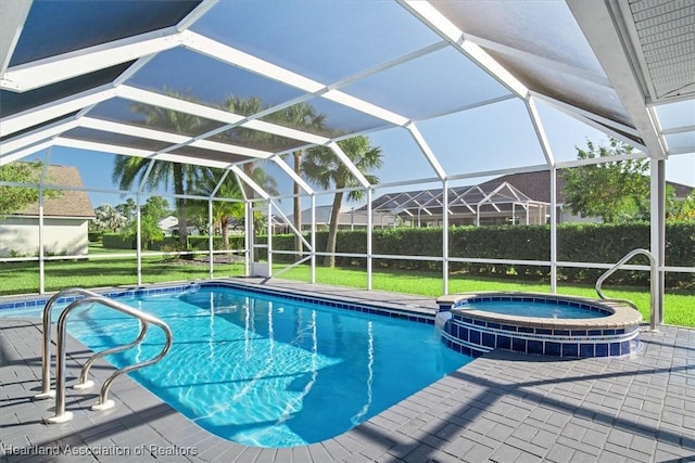 view of pool featuring a lanai, a patio area, an in ground hot tub, and a yard