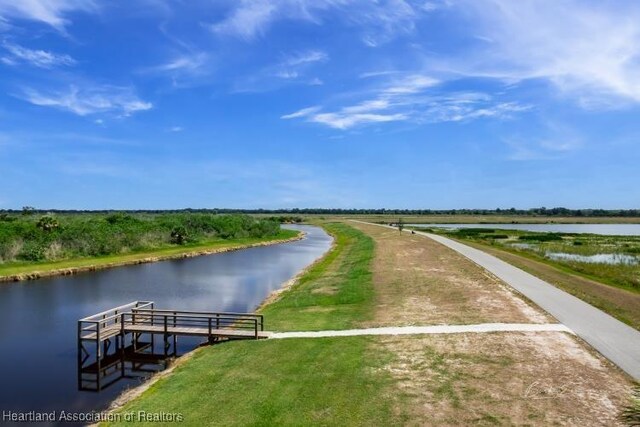 view of home's community with a water view