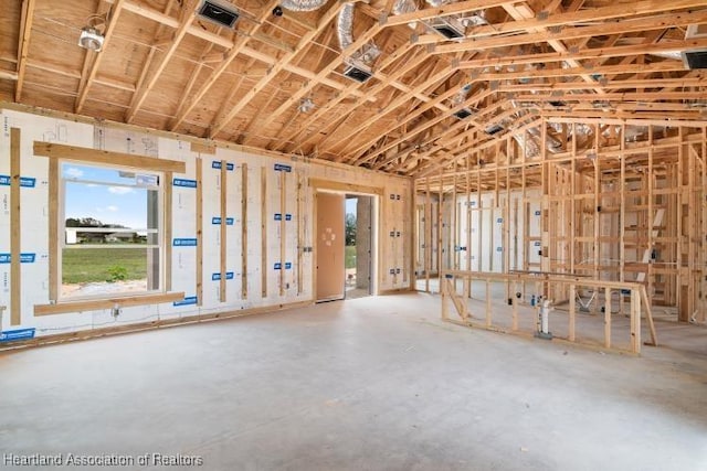 miscellaneous room with lofted ceiling