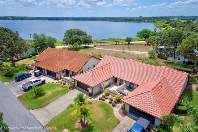 birds eye view of property with a water view