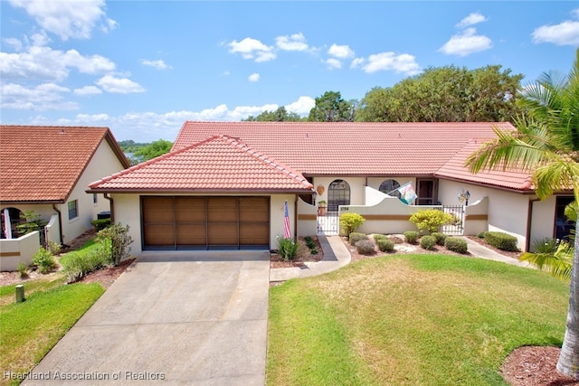 view of front of property featuring a garage and a front yard