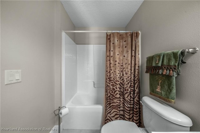 bathroom featuring shower / tub combo, a textured ceiling, and toilet