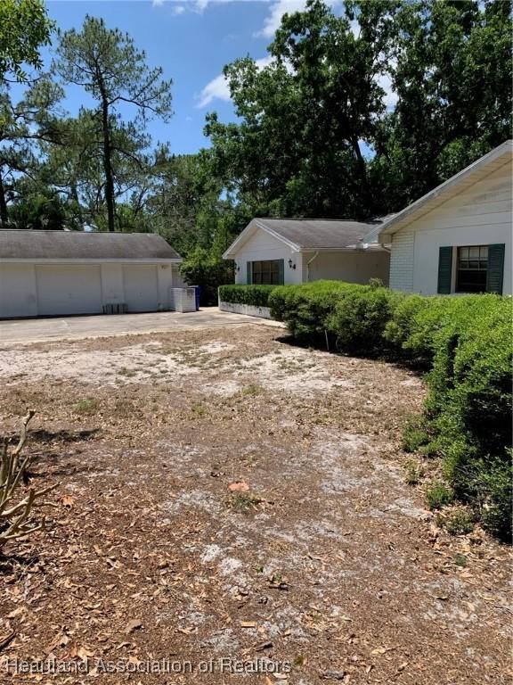 view of yard with a garage