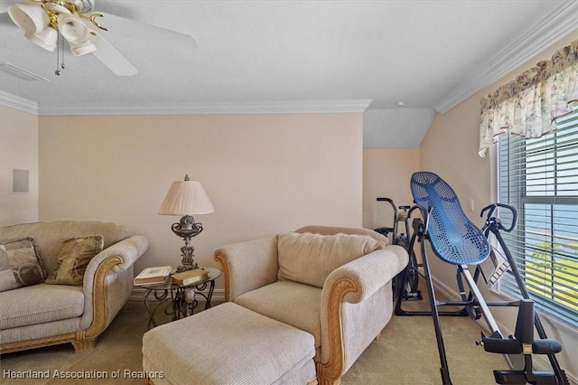 living room with crown molding, ceiling fan, and light colored carpet