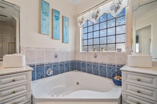 bathroom with a washtub, vanity, and crown molding