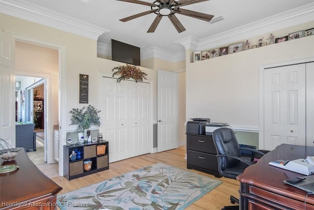 office with hardwood / wood-style flooring, ceiling fan, and ornamental molding