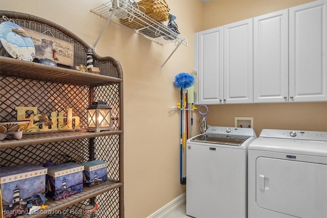 laundry room with cabinets and independent washer and dryer