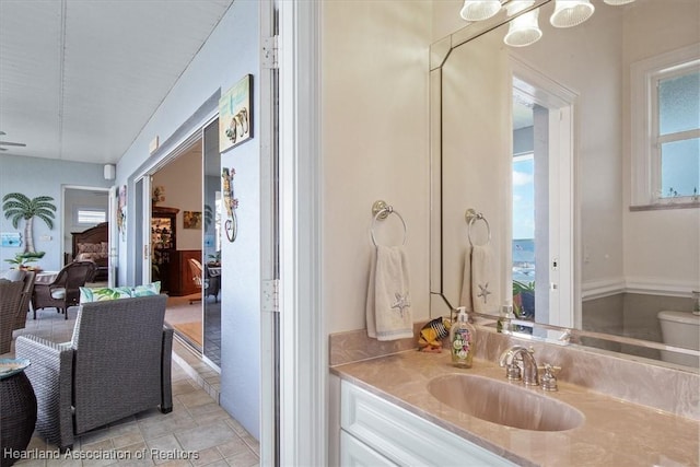 bathroom featuring vanity and toilet