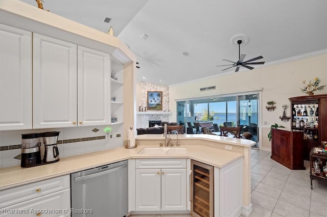 kitchen featuring white cabinetry, dishwasher, sink, wine cooler, and kitchen peninsula