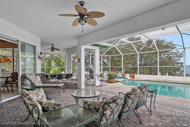 interior space with ceiling fan