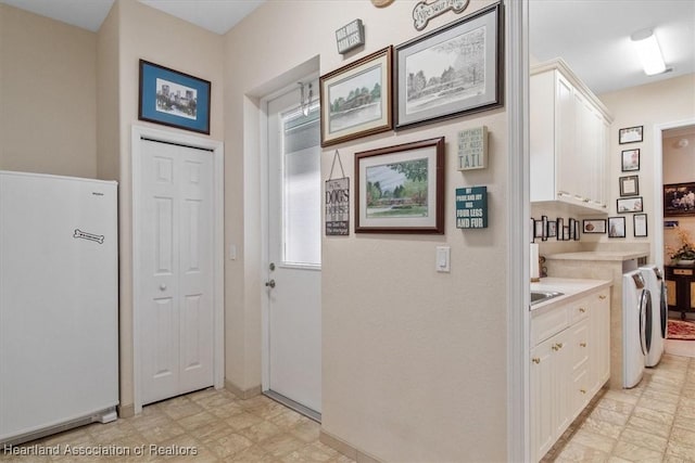 hallway with washing machine and clothes dryer