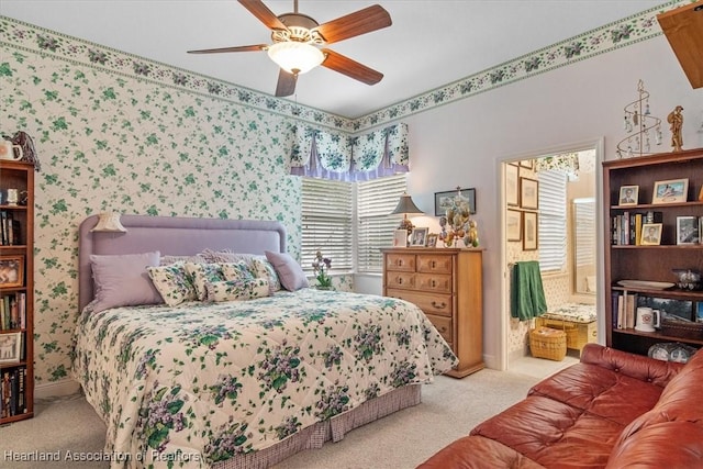 bedroom featuring ceiling fan and light carpet