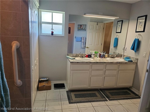 bathroom with vanity and tile patterned floors