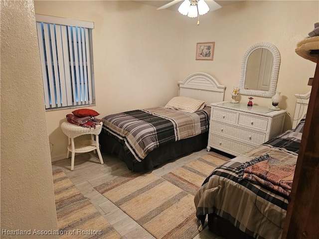 bedroom featuring ceiling fan and light hardwood / wood-style floors