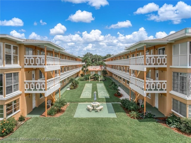 2113 Lakeview Dr Unit 1B, Sebring, FL 33870 - view of home's community featuring shuffleboard and a lawn