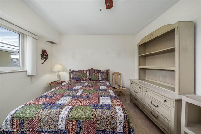 carpeted bedroom with ceiling fan