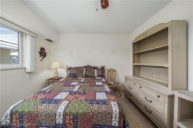 2113 Lakeview Dr Unit 1B, Sebring, FL 33870 - carpeted bedroom featuring a ceiling fan