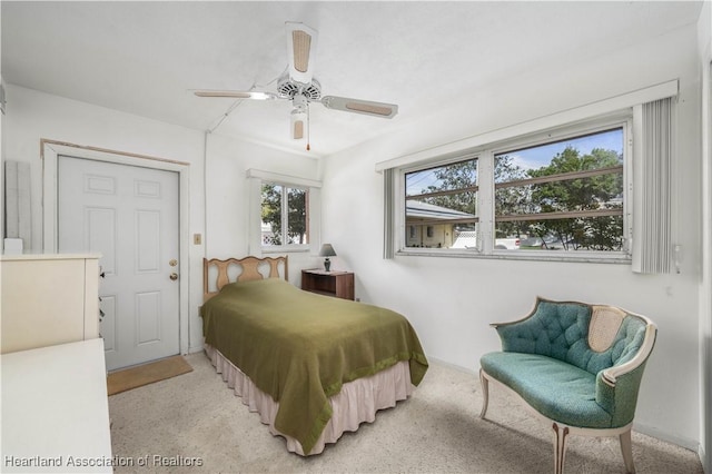 2113 Lakeview Dr Unit 1B, Sebring, FL 33870 - bedroom with ceiling fan and light carpet