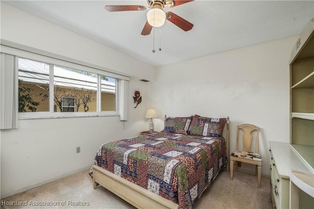 carpeted bedroom featuring ceiling fan