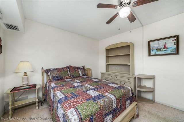 bedroom with light carpet and ceiling fan