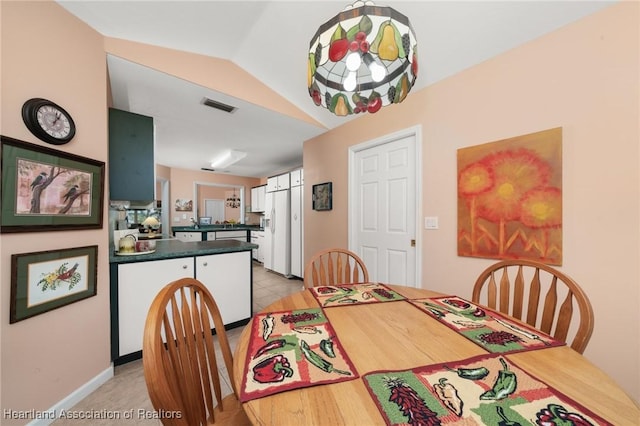 dining room featuring visible vents and baseboards