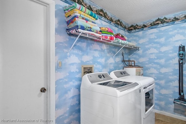 laundry room with independent washer and dryer, a textured ceiling, tile patterned flooring, and water heater