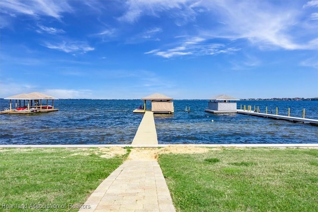 dock area with a water view