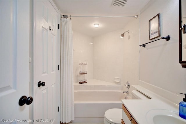 full bathroom with shower / tub combo with curtain, vanity, and toilet