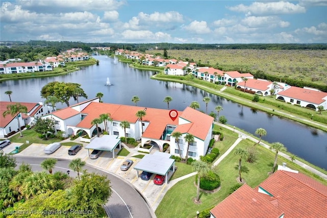 birds eye view of property featuring a water view