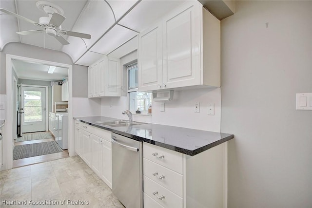 kitchen featuring stainless steel dishwasher, washer and clothes dryer, ceiling fan, sink, and white cabinetry