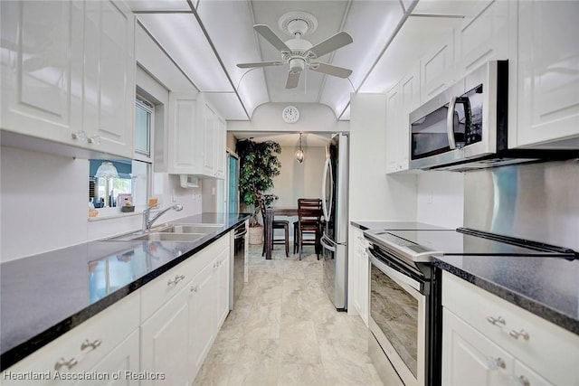 kitchen with ceiling fan, sink, white cabinets, and stainless steel appliances