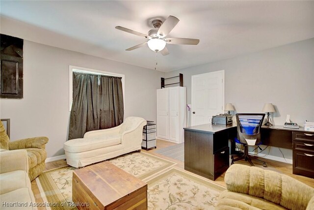 office area featuring ceiling fan and light wood-type flooring