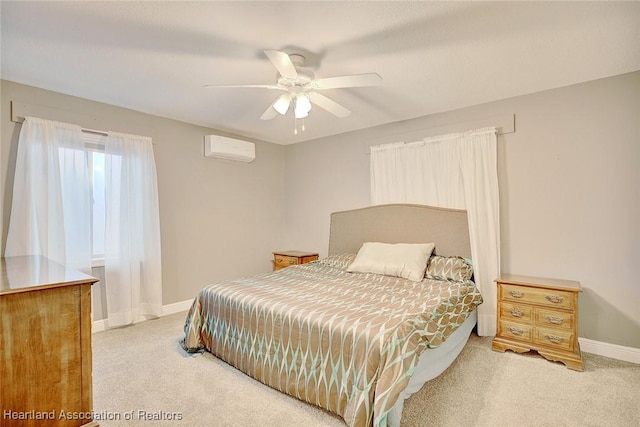 carpeted bedroom featuring a wall mounted AC and ceiling fan