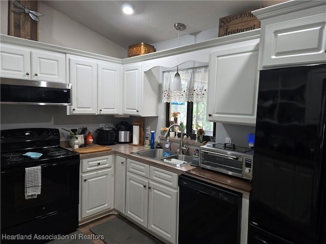 55 Lake Side Trl, Lake Placid, FL 33852 - kitchen featuring black appliances, a sink, lofted ceiling, and white cabinets
