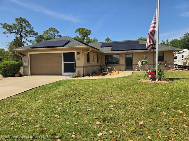 ranch-style house with a front lawn, stucco siding, concrete driveway, solar panels, and a garage