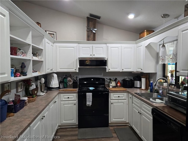 55 Lake Side Trl, Lake Placid, FL 33852 - kitchen with black appliances, a sink, vaulted ceiling, open shelves, and white cabinetry