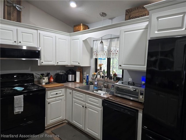 55 Lake Side Trl, Lake Placid, FL 33852 - kitchen featuring black appliances, a sink, lofted ceiling, and white cabinetry