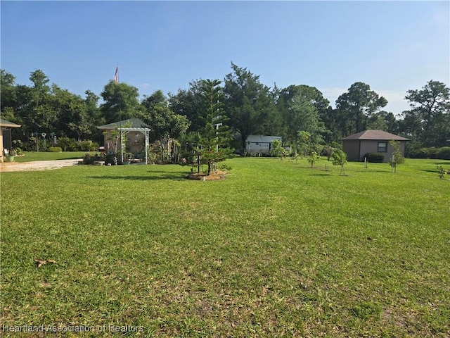 55 Lake Side Trl, Lake Placid, FL 33852 - view of grassy yard featuring a gazebo