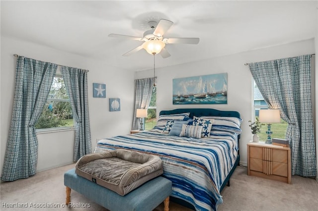 carpeted bedroom featuring ceiling fan