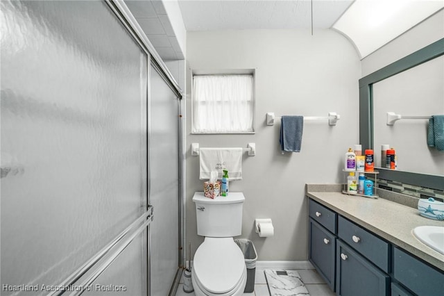 bathroom with vanity, toilet, and walk in shower