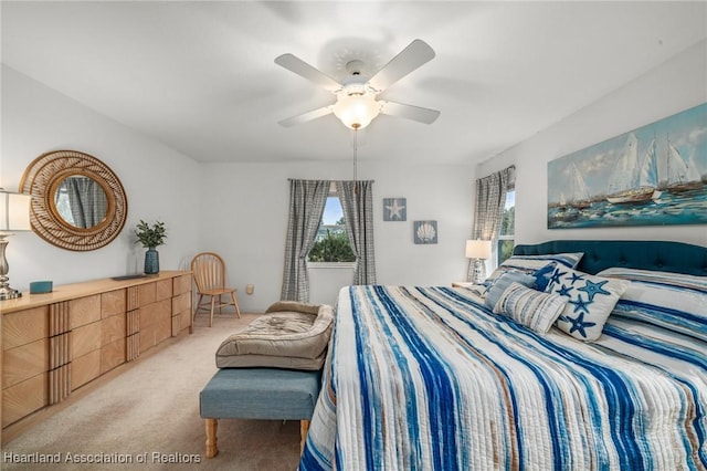 bedroom with light colored carpet and ceiling fan