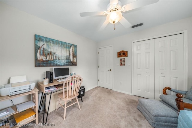 home office featuring ceiling fan and light colored carpet