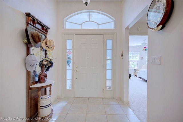 entryway featuring light carpet