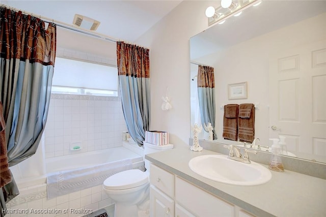 full bathroom with toilet, shower / tub combo, and vanity