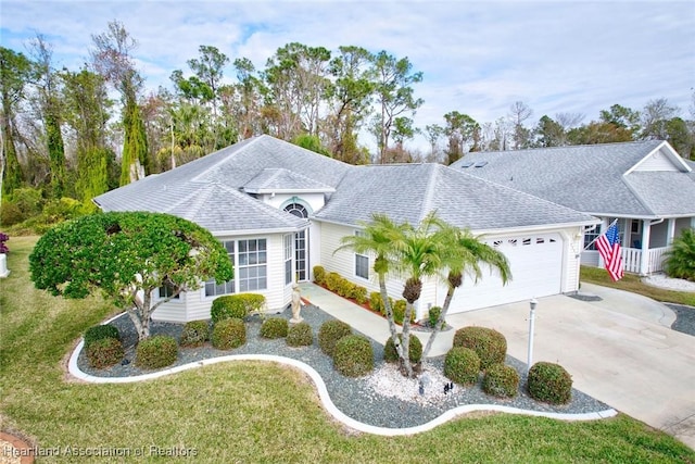 ranch-style home featuring a front yard and a garage